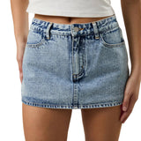 Person wearing a light blue denim skirt on a neutral background