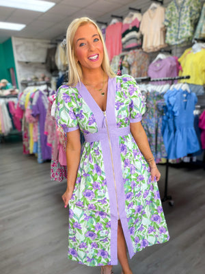 Woman wearing a floral dress in a clothing store