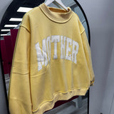 Mother Butter Yellow Mock Neck