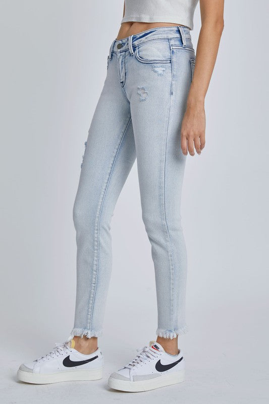 The Megan Light Wash Low Rise Ankle Skinny with Frayed Hem
